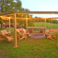 This DIY Backyard Pergola With Swings Is The Perfect Piece To Surround Your Fire Pit