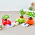 These Self-Watering Dinosaur Planters Slurp Up Their Water As They Need It
