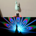 This LED Peacock Night-Light Projects Its Colorful Plumage Onto Your Wall