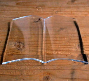 This Ingenious Glass Book Page Holder Keeps Your Book Open For Hands-Free Reading