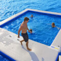 These Inflatable Ocean Pools Give You A Closed-Off Swimming Area In a Lake Or Ocean