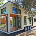 This Farmhouse Style Tiny Home Has Its Own Built-In Porch Area