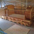 This Handmade Wooden Train Crib Pulls Behind a Dresser Train Car