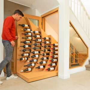 The Wave Wine Rack Is a Unique Slide-Out Wine Cellar That's Under Your Stairs