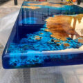 This Blue River Epoxy Table Is Made To Look Like a Satellite View Of Earth