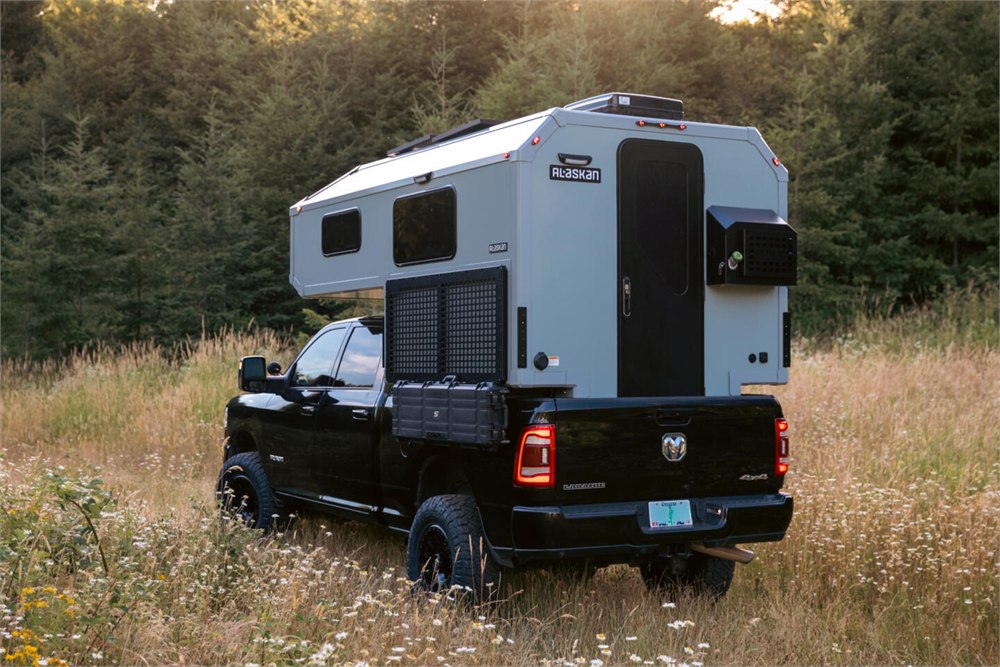 Rear view of the Alaskan HS 640 hard-side camper on a pickup
