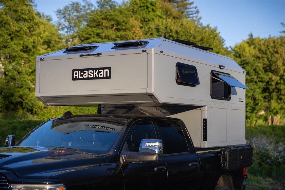 Side exterior view of the Alaskan HS 640 camper on a truck