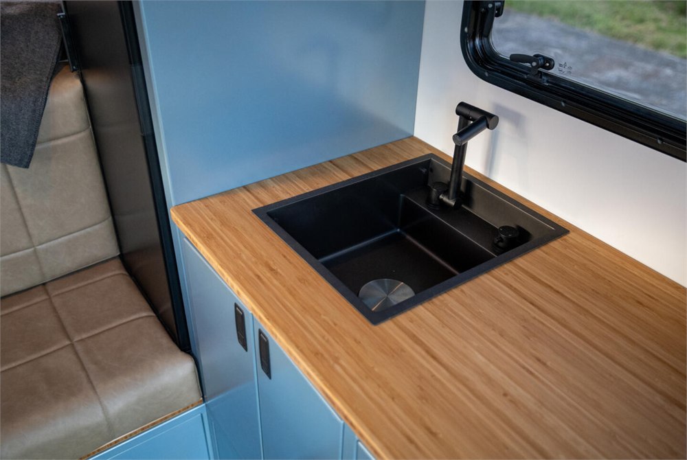 Interior counter and sink area inside the Alaskan HS 640 camper