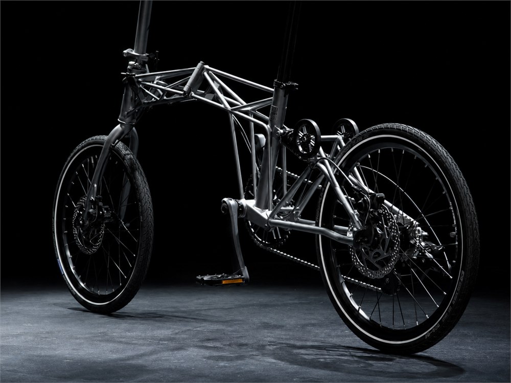 Rear three-quarter view of the Tetra bike showing its suspension and frame
