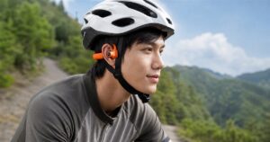 Auriview X1 AI camera bone-conduction headset worn under a bicycle helmet outdoors
