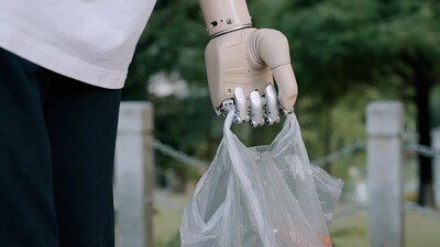 BrainCo bionic hand carrying an object during daily use