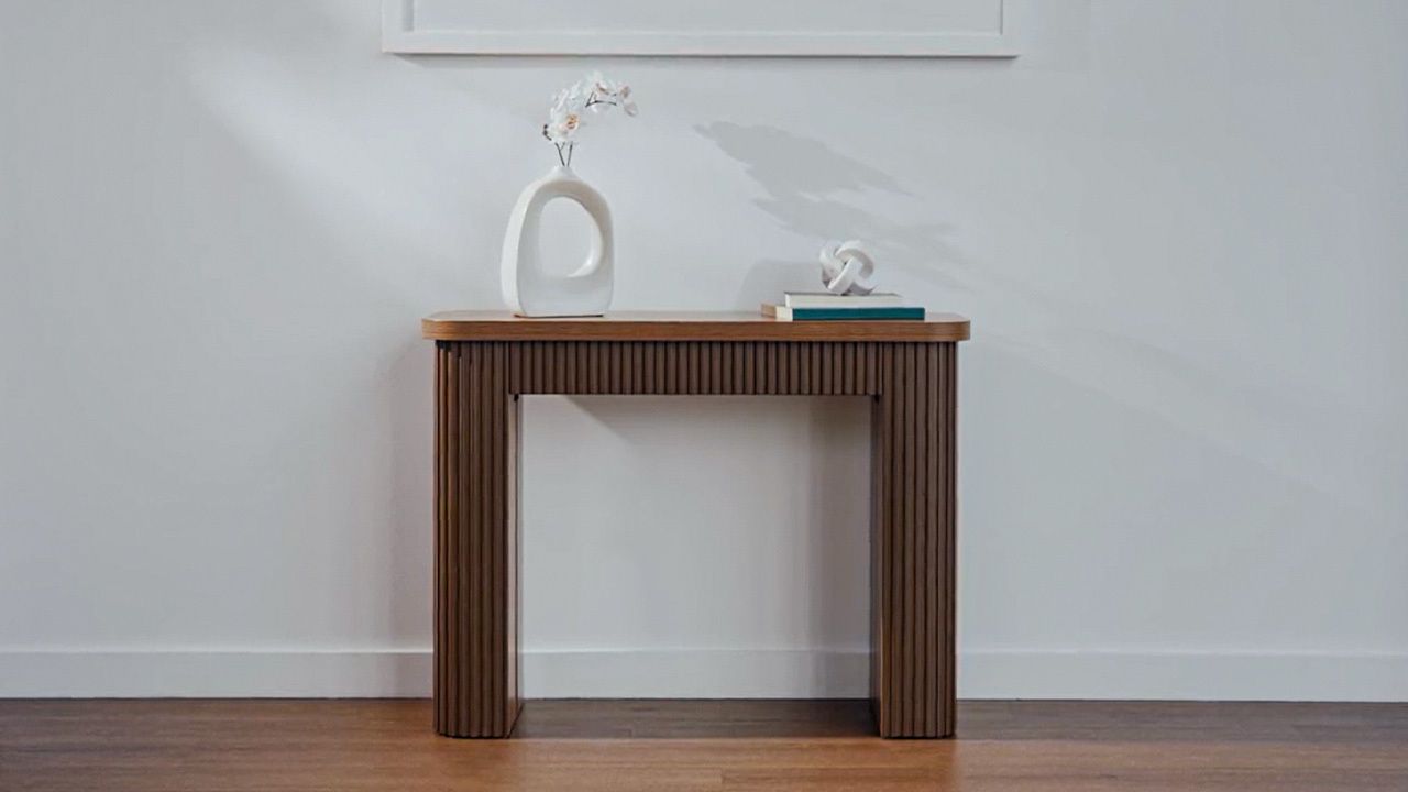 Coco Slim wooden console table standing against a wall