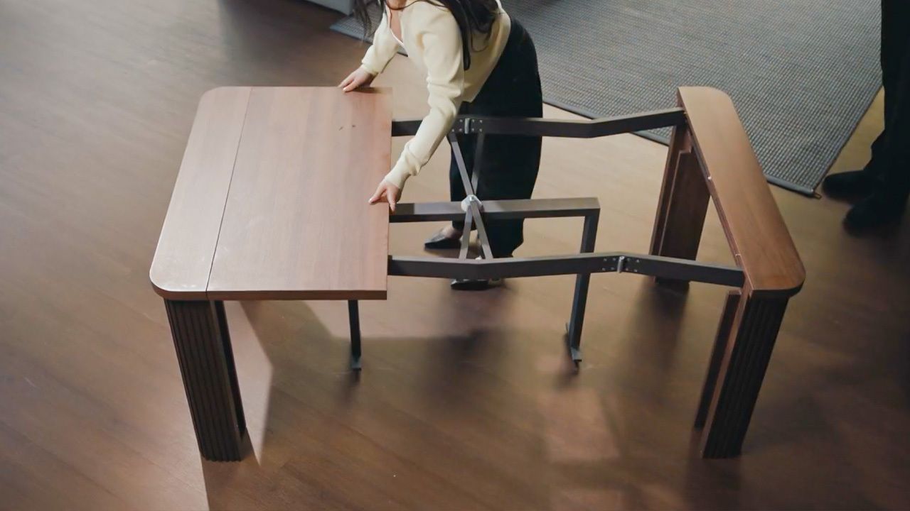 A tabletop panel being inserted into the Coco Slim transforming table