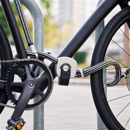 Close-up of Cordalock central lock and double-loop cable on a bicycle
