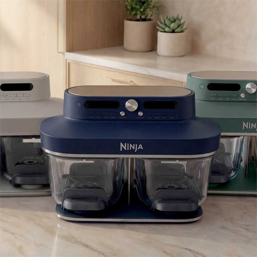 Ninja CRISPi DualZone glass air fryer on a kitchen counter with color variants