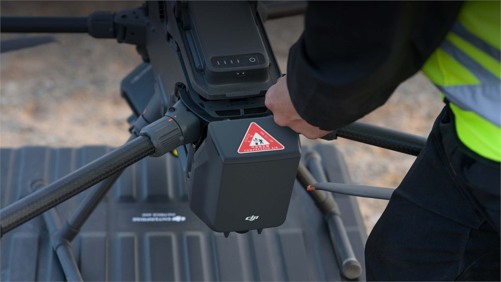 Close view of the DJI AP100 parachute module mounted on the Matrice 400
