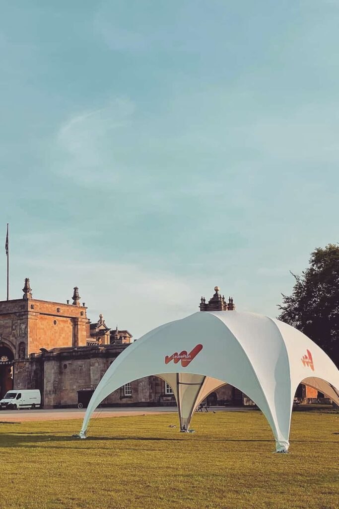 Side view of the white arched DreamDomes Crossover L event canopy