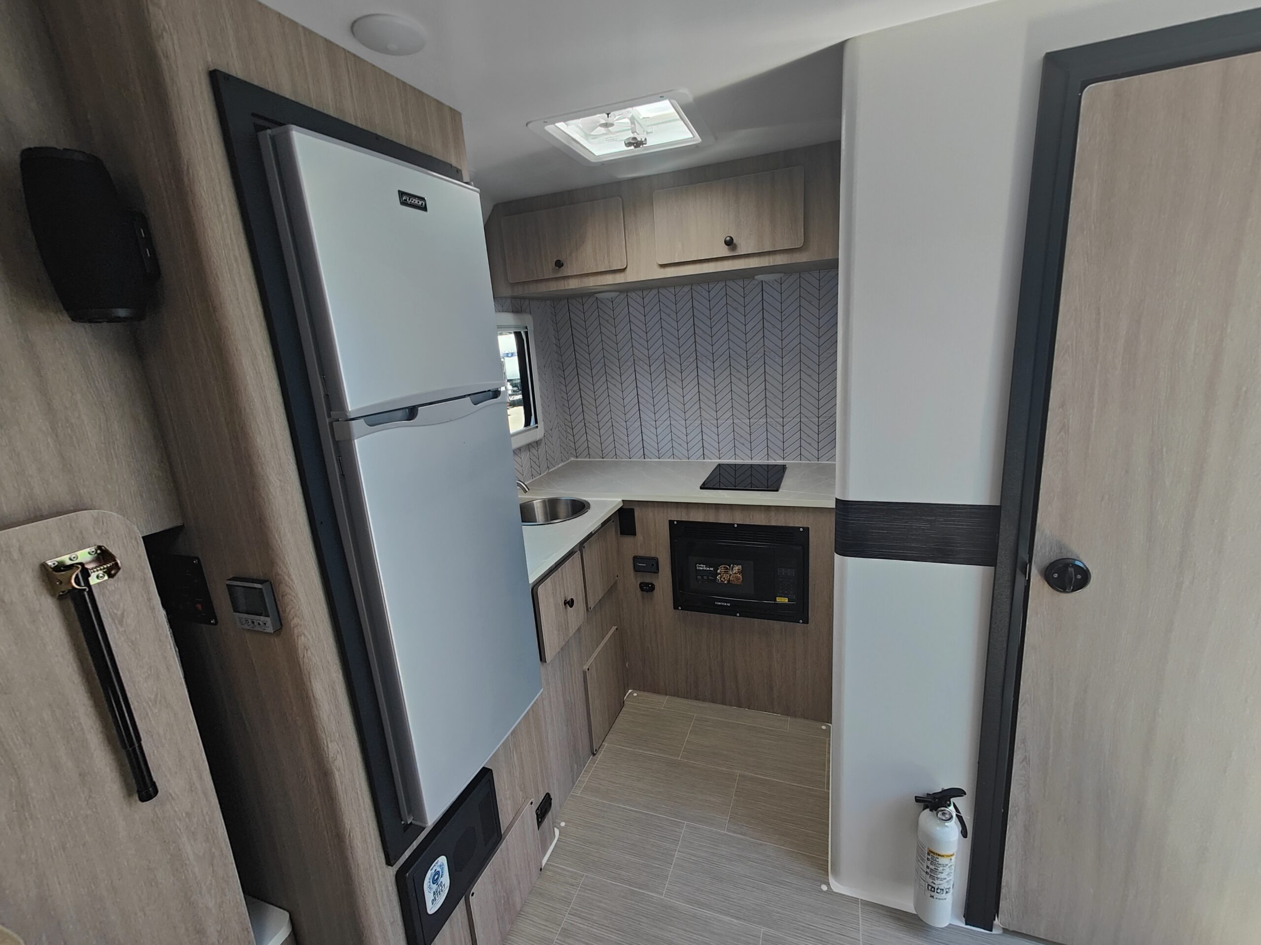 Compact electric kitchen area inside the LIV E-Leaf OffRoad camper trailer