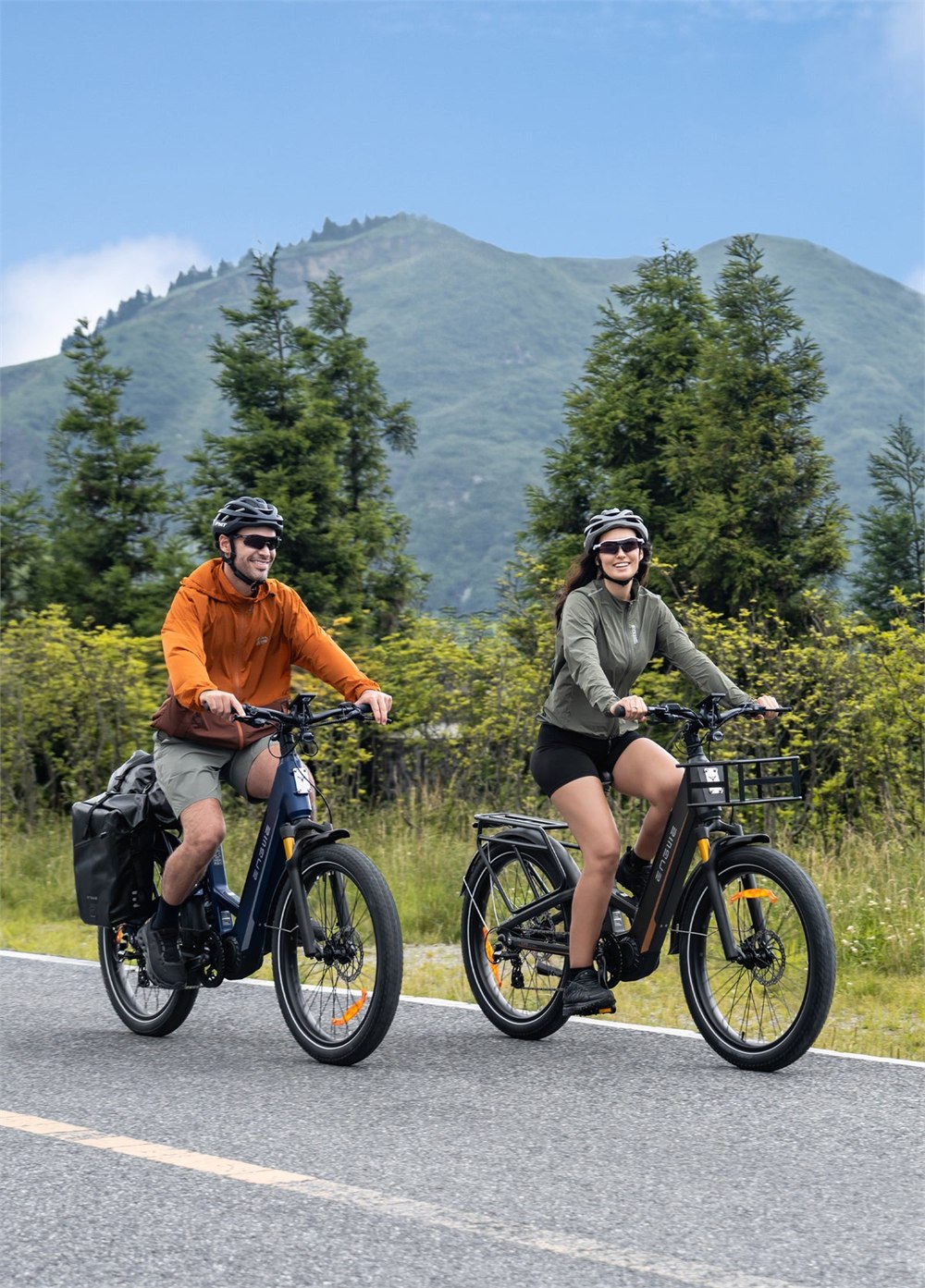 Two ENGWE E26 3.0 Pro e-bikes riding on a mountain road
