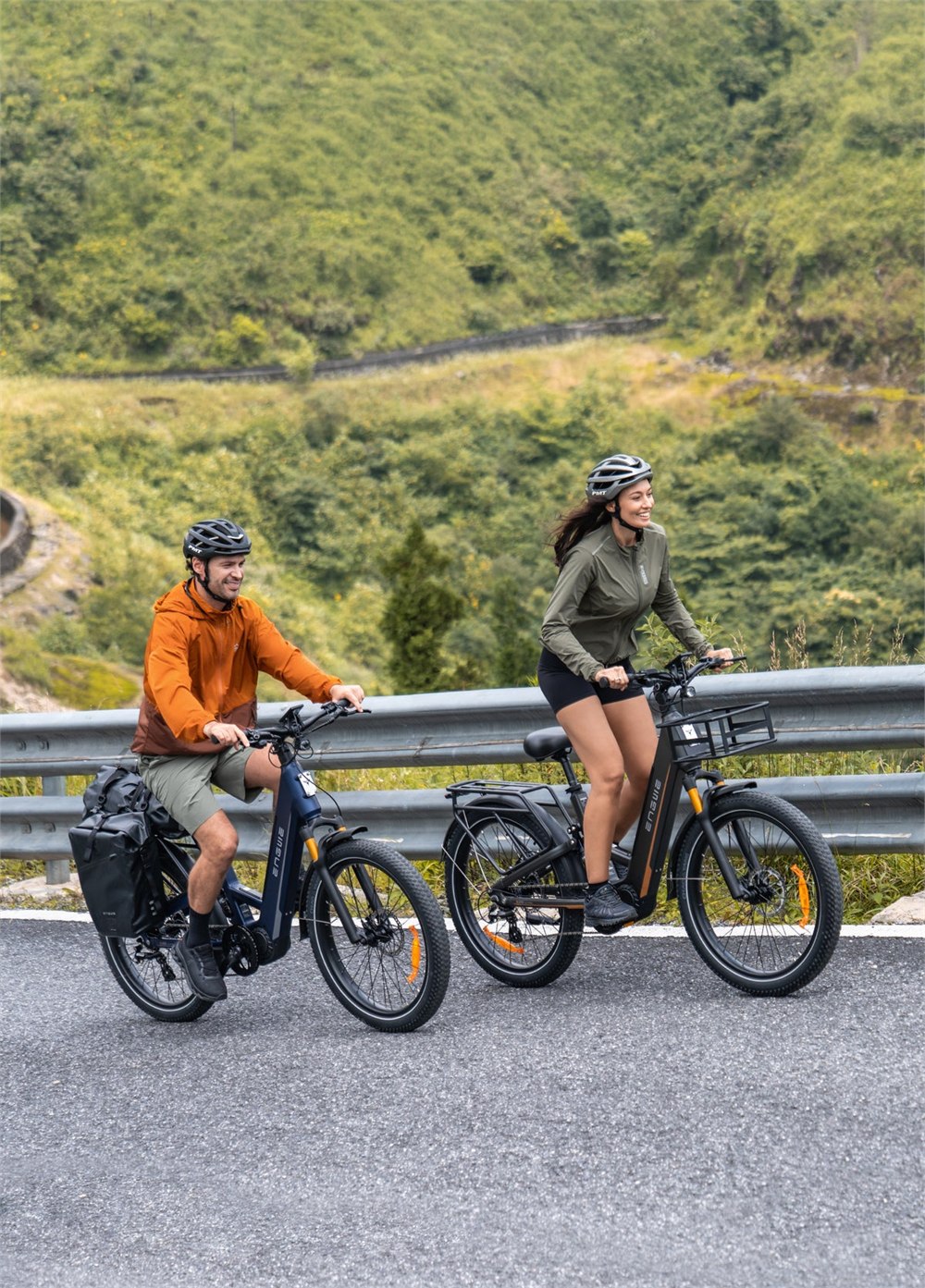 ENGWE E26 3.0 Pro e-bikes riding along a guardrail road
