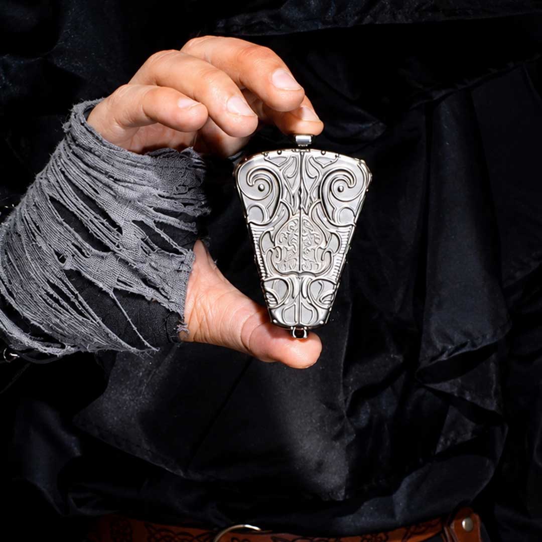 OMENDIAL DICE held in one hand to show its compact size