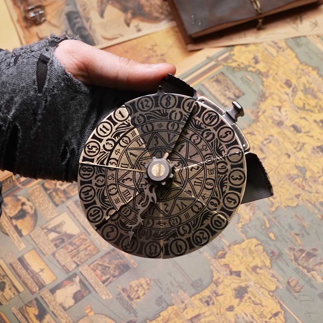 OMENDIAL DICE open spinner face resting on a hand above a map