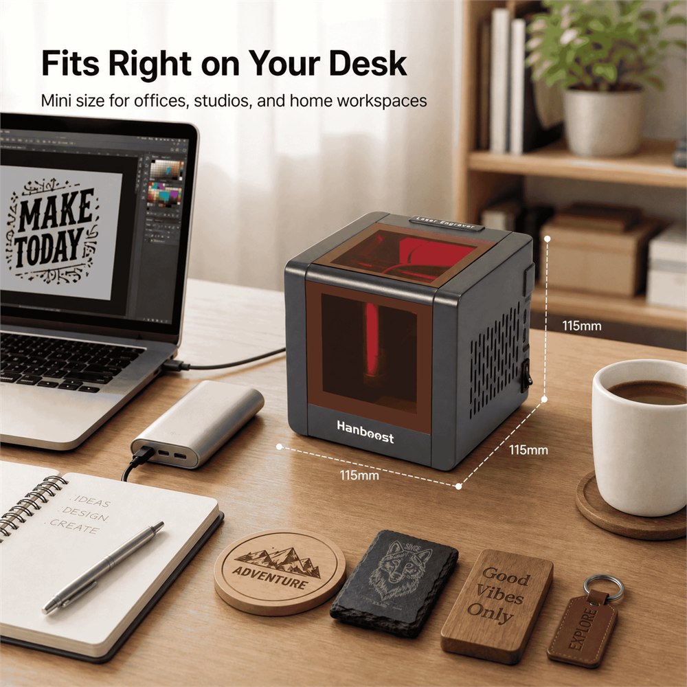 Hanboost T1 mini laser engraver fitting on a desk beside craft samples