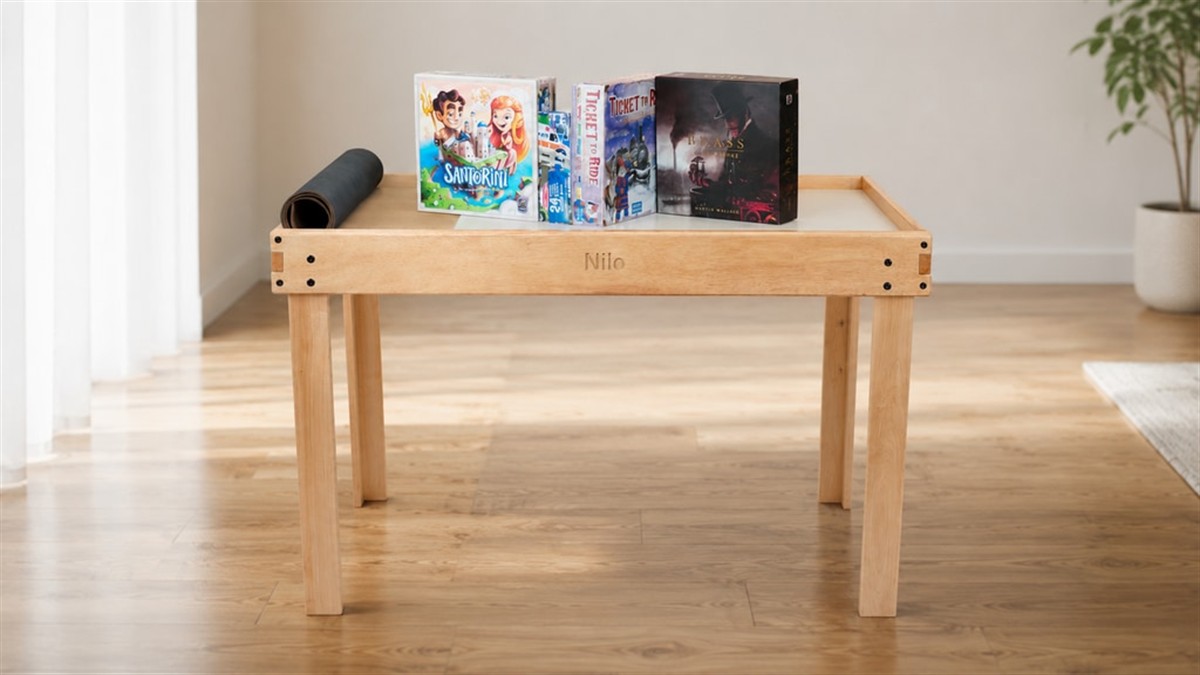 Nilo Game Table in a bright living room with board games on top