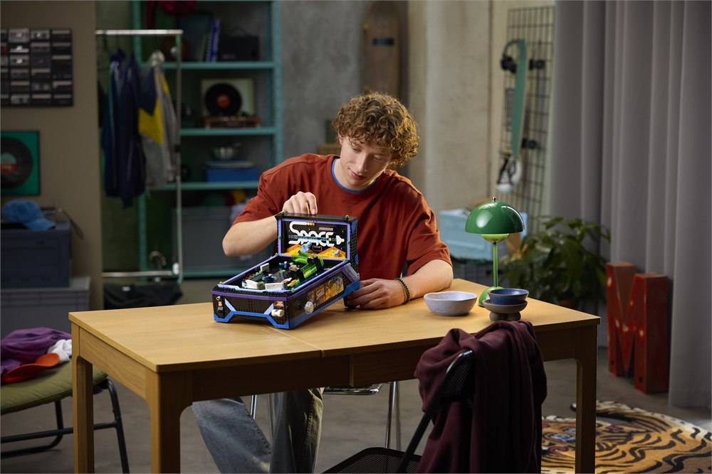 Lifestyle image of the LEGO Icons Arcade Pinball Machine being played on a table