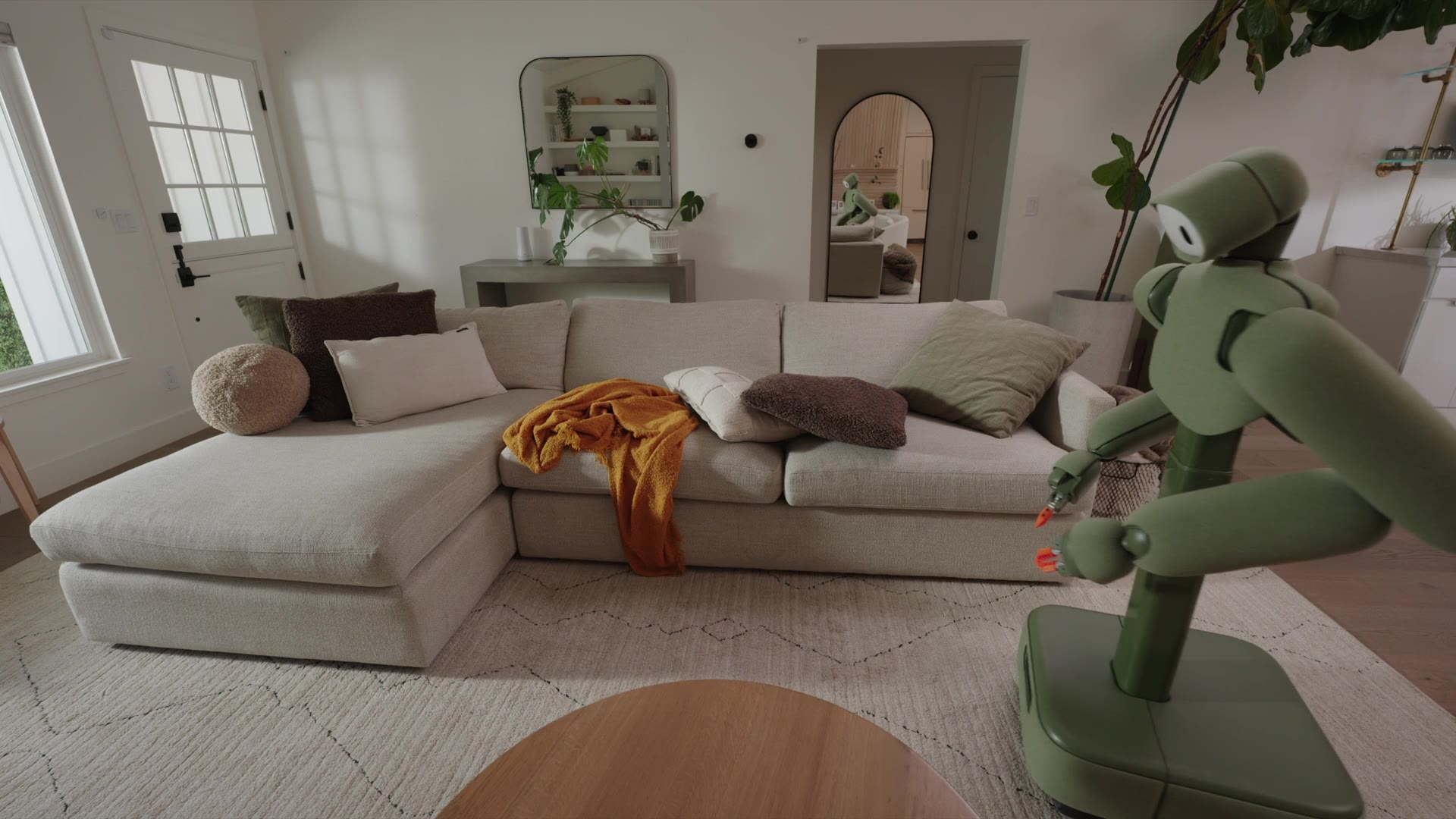 Isaac 1 home robot picking up clutter in a room