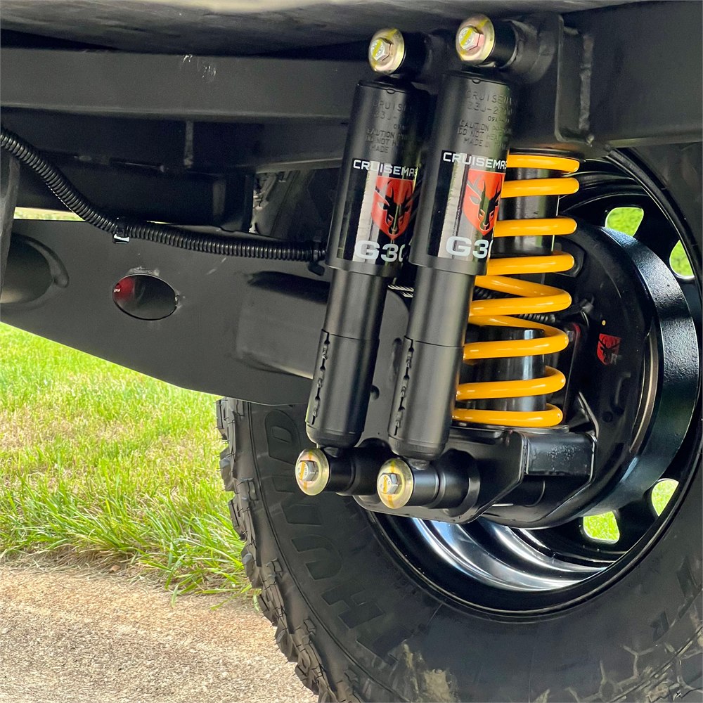 Cruisemaster off-road suspension and 33-inch tire detail on the Adventure Pro Mini 2.0