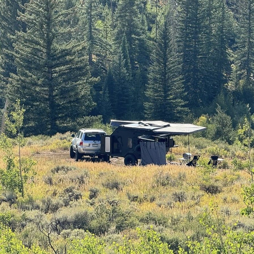 Adventure Pro Mini 2.0 parked in a remote camping area