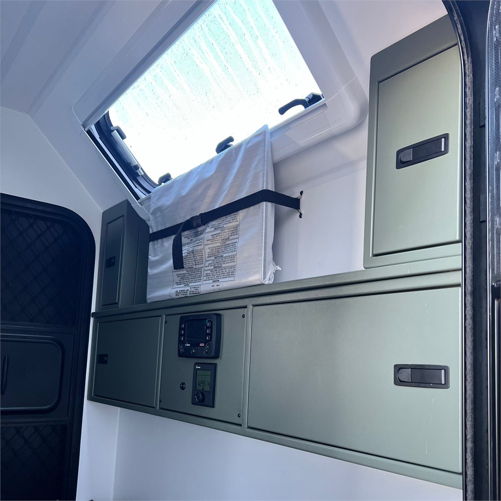 Interior storage and window inside the Adventure Pro Mini 2.0 camper