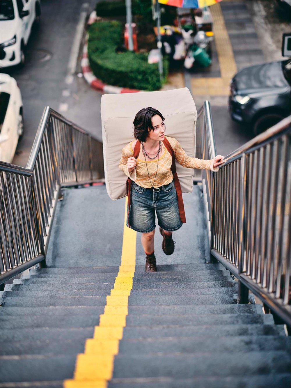 IKEA KOMPISHANG portable furniture carried up outdoor stairs.