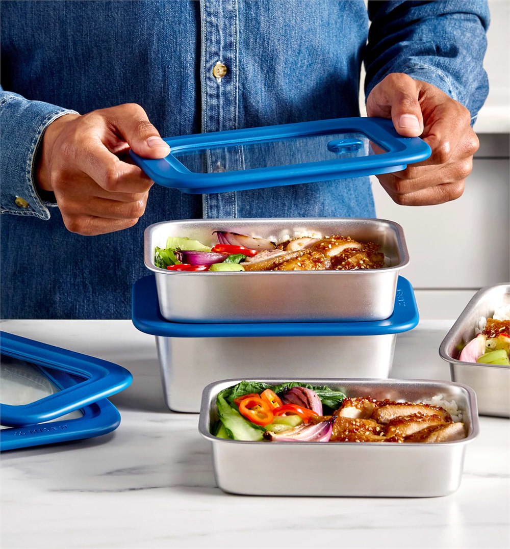 Misenware stainless containers filled with meal prep food and blue lids
