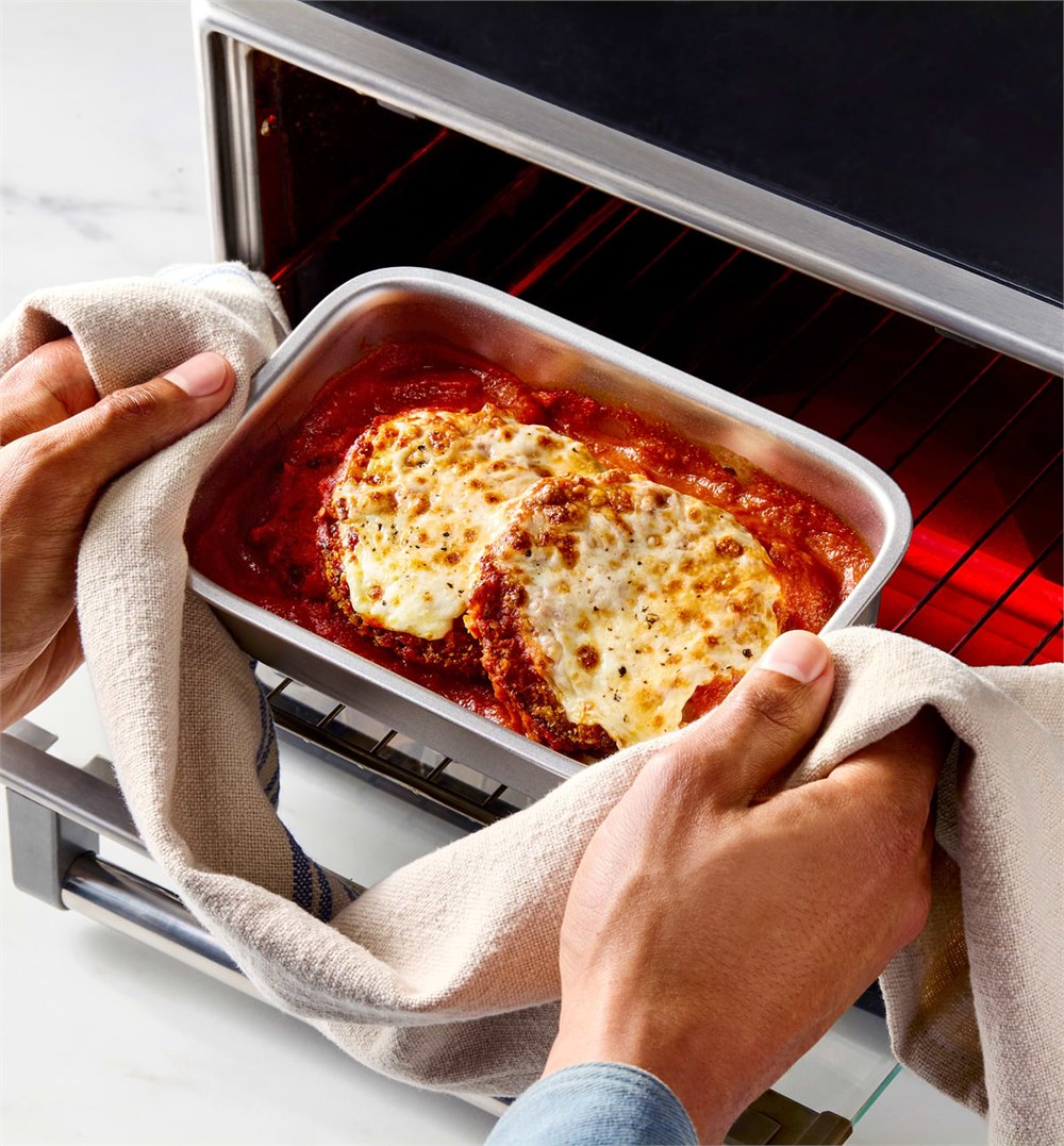 Misenware stainless food container being removed from an oven