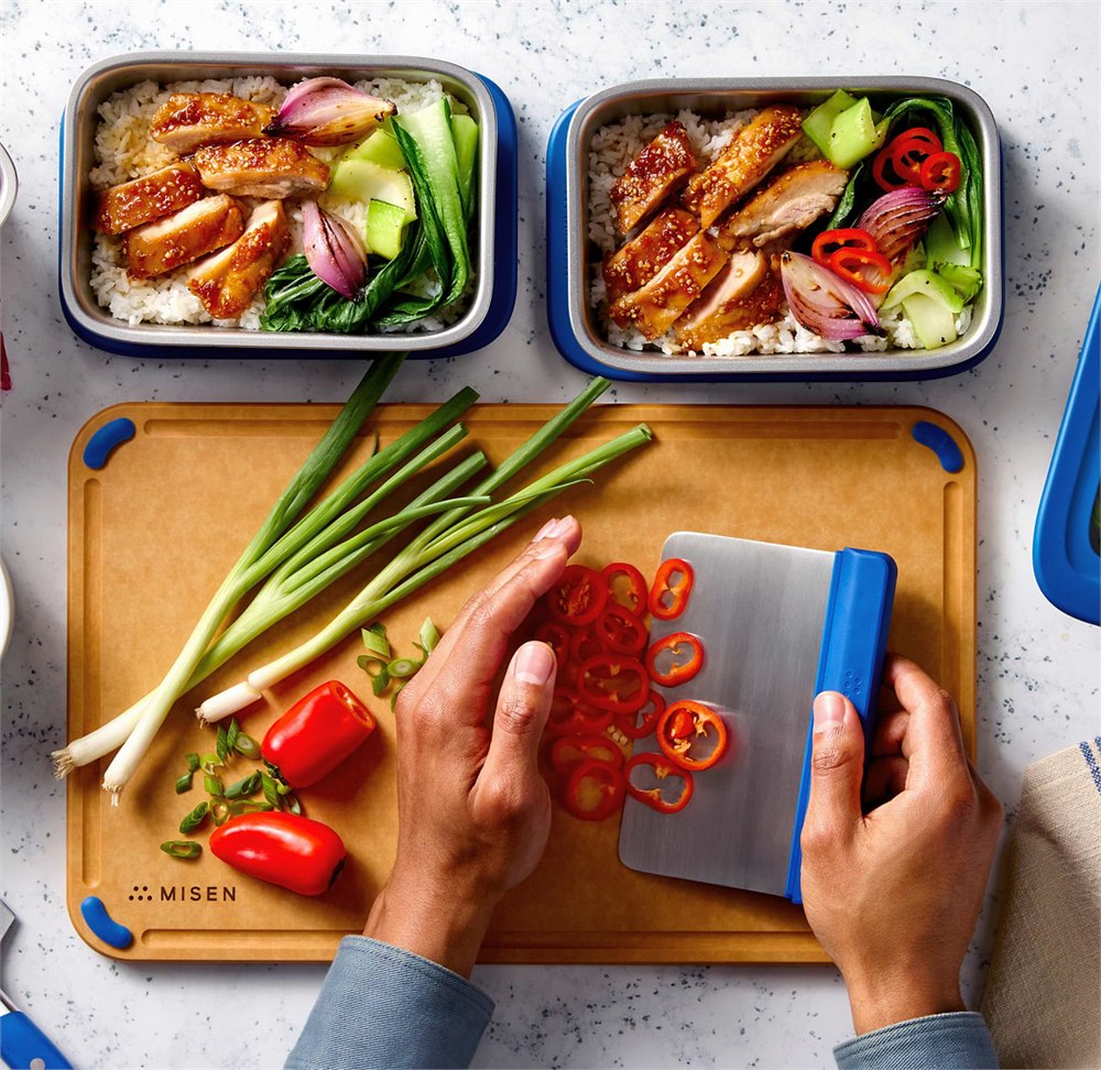 Top-down meal prep scene with Misenware stainless containers