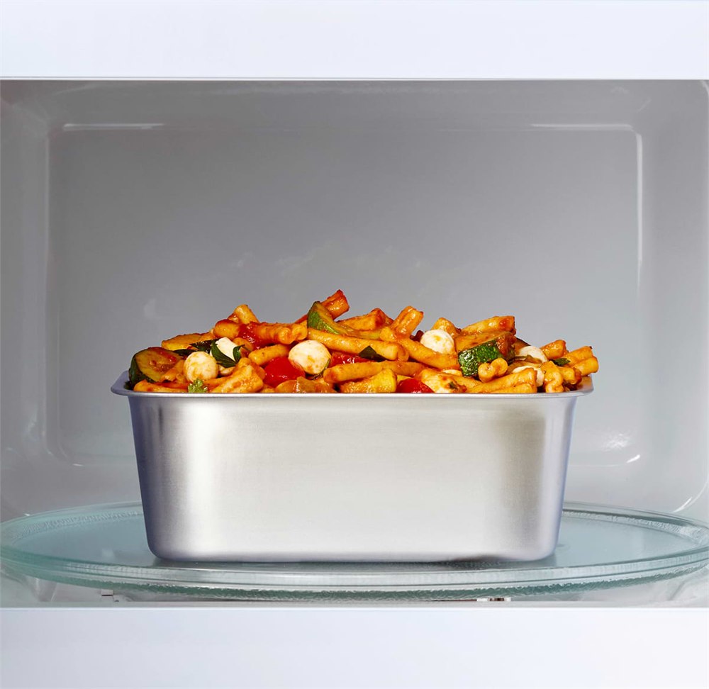 Misenware stainless food container sitting inside a microwave