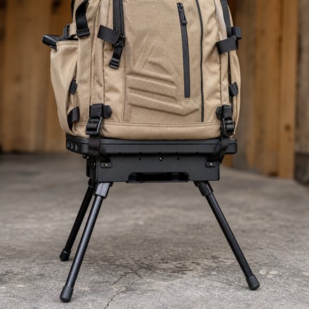 Mojoh Ryzer Go bag stand attached under a backpack
