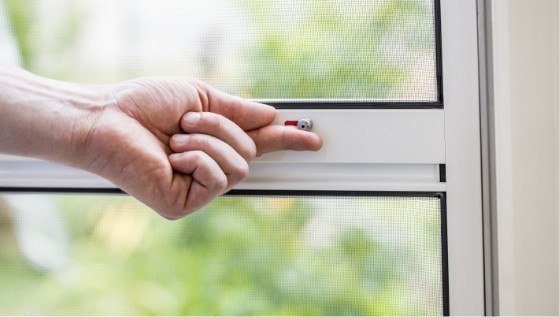 Close-up of the optional locking detail on a Neher insect screen swing door