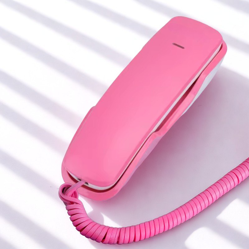 Pink Pinwheel Home Classic phone on a table
