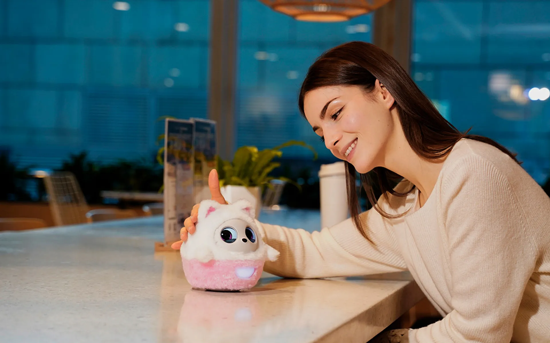 Pophie AI companion robot sitting on a desktop