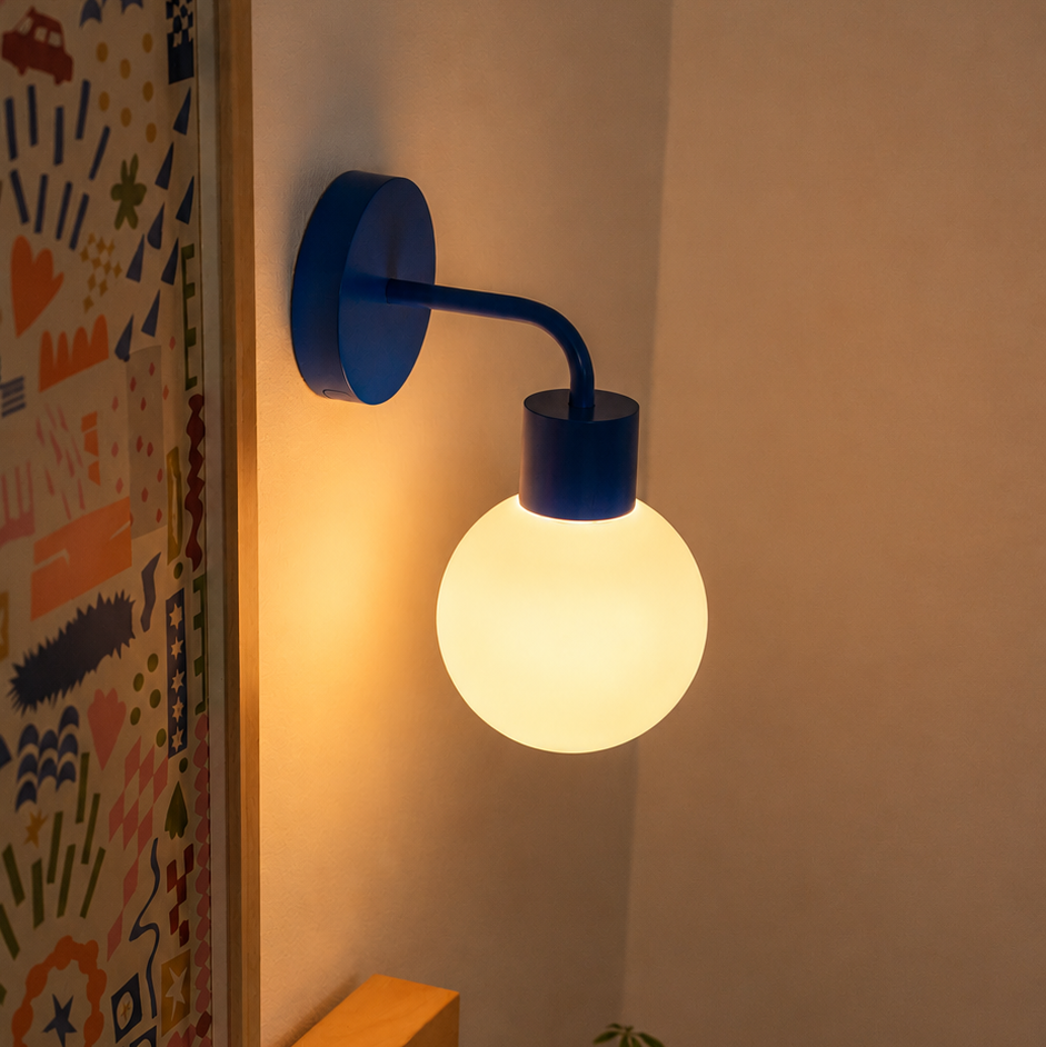 Blue Poplight rechargeable wall light beside a bed