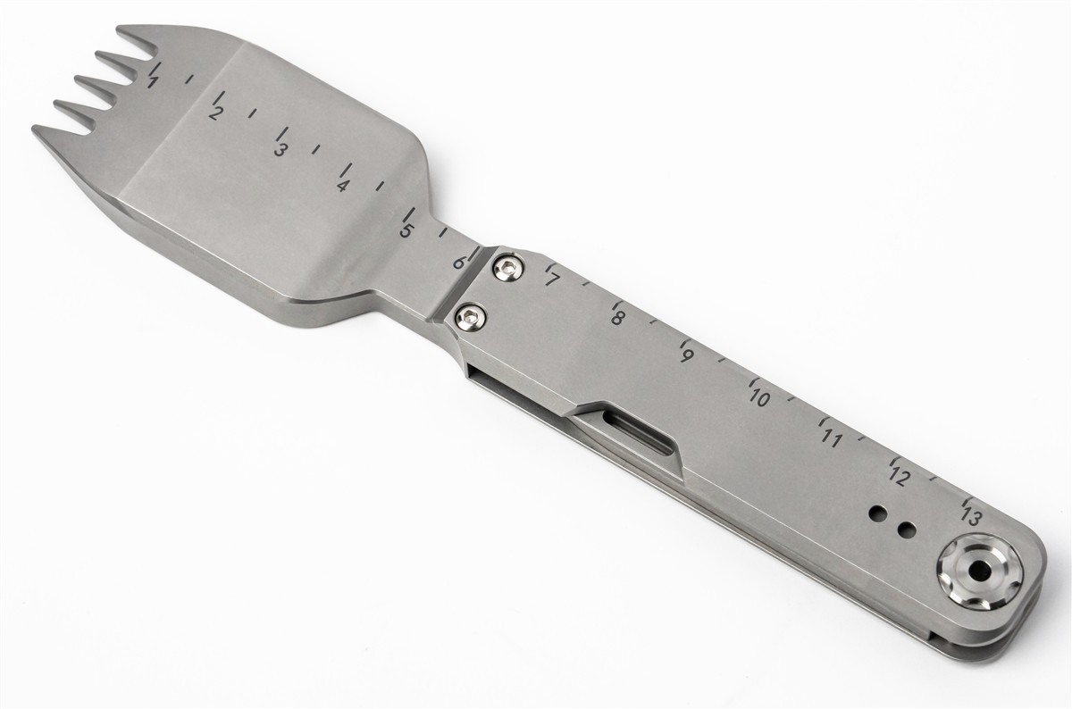 The FieldSpork in an outdoor cooking setup with its titanium tools visible