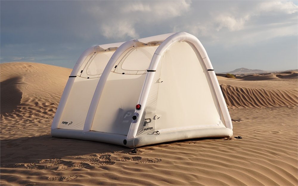 Puffer inflatable tent pitched in a desert landscape
