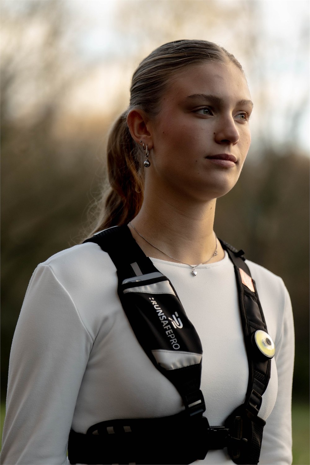 Runner wearing the RunSafePro smart vest from the front