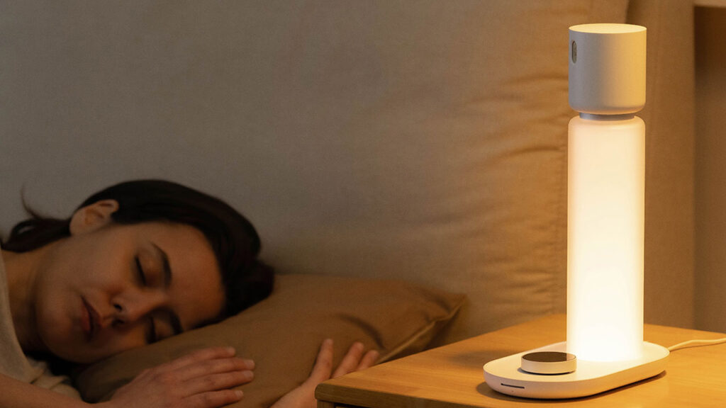 Sleepal AI Lamp glowing next to a sleeping person