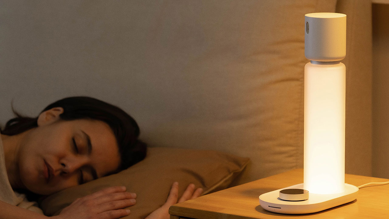 Sleepal AI Lamp glowing next to a sleeping person