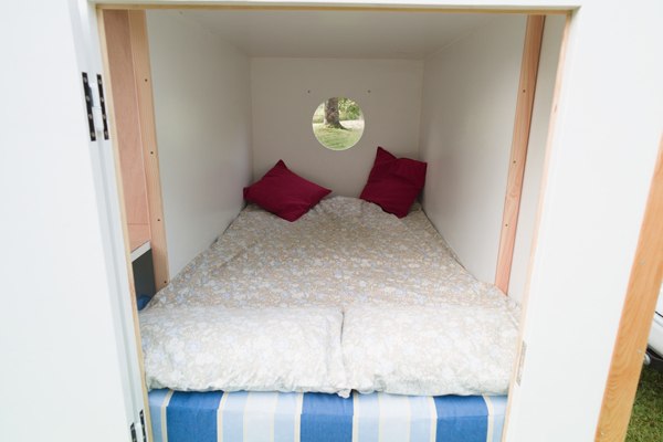Woodenwidget Slidabox bright interior with two metre bed area