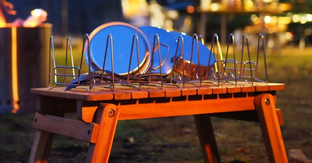 Slim Fold Dish Rack opened on a camping table